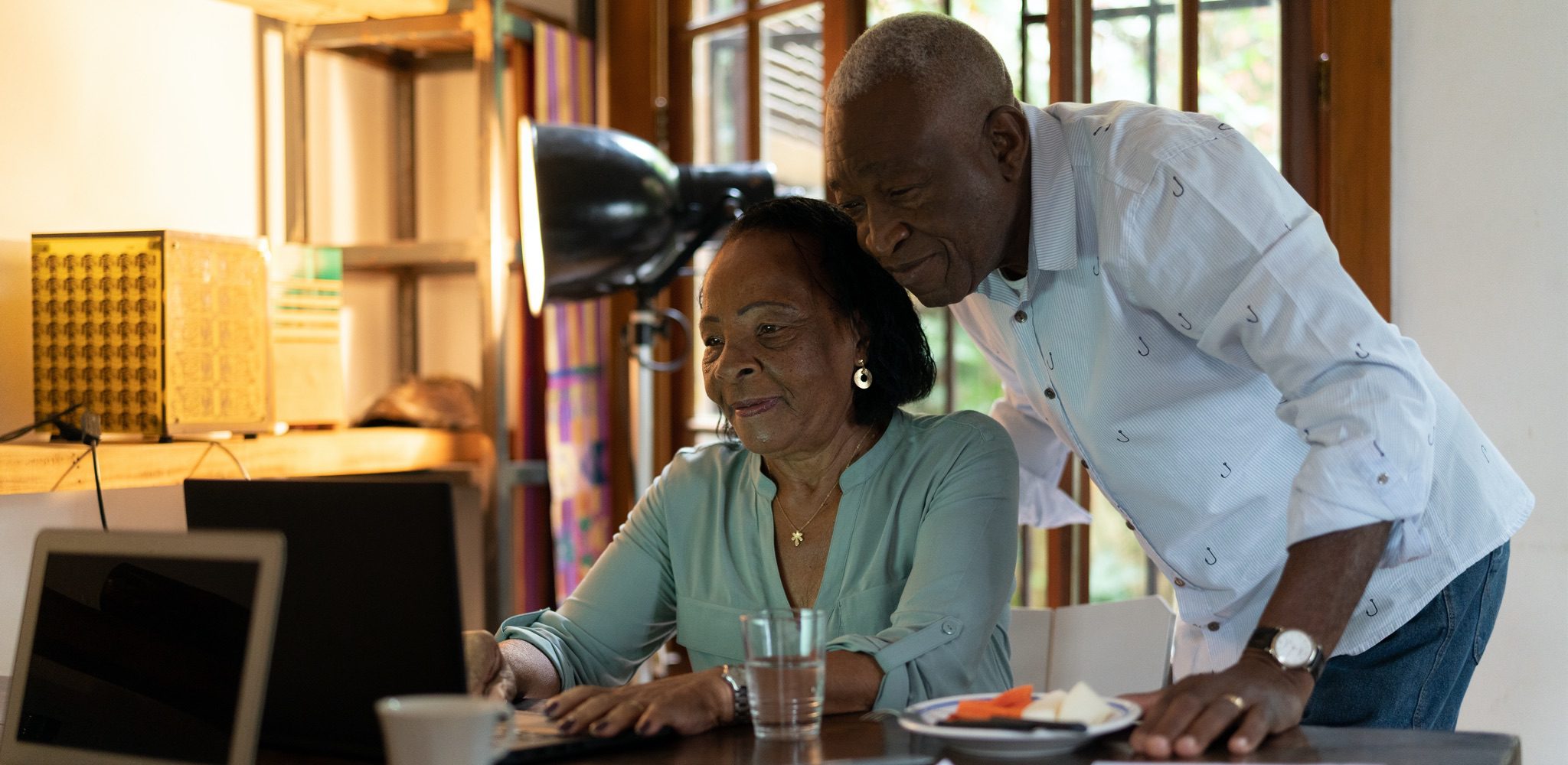 Senior African-American couple looking at computer.
